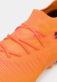 Puma FUTURE 8 MATCH MG pomarańczowy