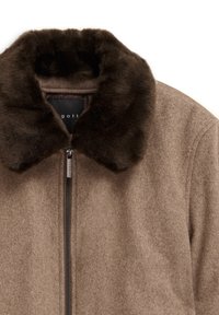 Brown wool-blend jacket with a dark brown faux fur collar. Features a front zipper and soft texture, highlighting a clean, minimal design.