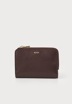 Burgundy leather wallet with a smooth texture, gold-tone zipper, and embossed logo. Features a compact rectangular design.