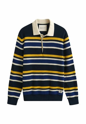 Pull en maille bleu marine avec des rayures horizontales blanches, jaunes et bleues, un col crème et une petite étiquette de marque près de l'ourlet.