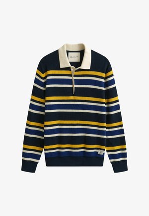 Pull en maille bleu marine avec des rayures horizontales blanches, jaunes et bleues, un col crème et une petite étiquette de marque près de l'ourlet.