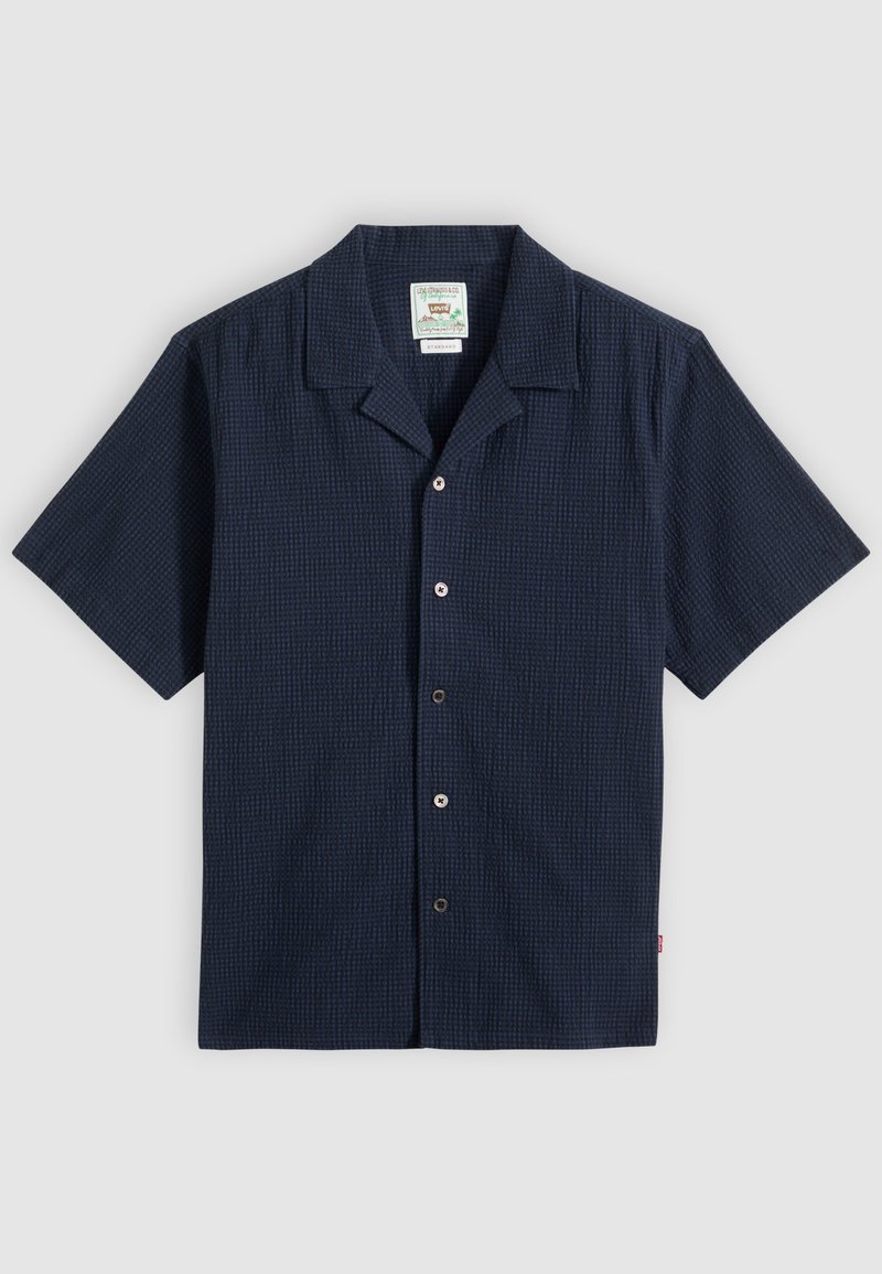 Marineblå kortærmet skjorte med knapper og struktureret stof samt en camp-krave, vist fladt på en lys baggrund.
