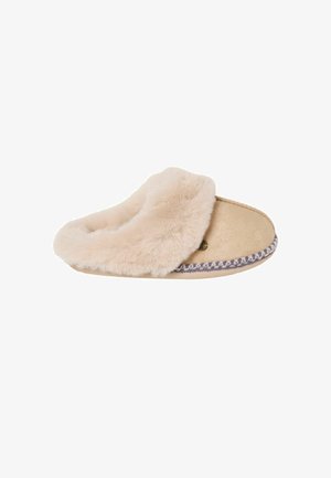Blød beige indendørs tøfler med tyk blød pelsforing og dekorativ syning langs sålkanten, designet til varme og komfort.