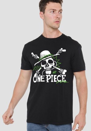 Young man wearing a black T-shirt with a white skull and crossbones design, a straw hat, and the text "One Piece" in white and green.