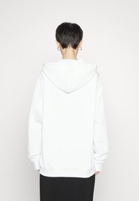 MOSCHINO Jersey con capucha - white