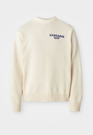 Pull en maille crème avec un col rond, des poignets et un ourlet côtelés, arborant le logo bleu "Carhartt WIP" sur le devant. Tissu texturé.