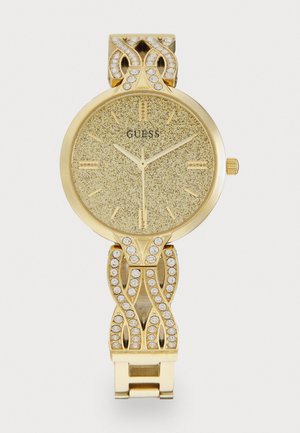 Gold-tone watch featuring a textured dial, adorned with sparkling accents on the band and a decorative metal link design.
