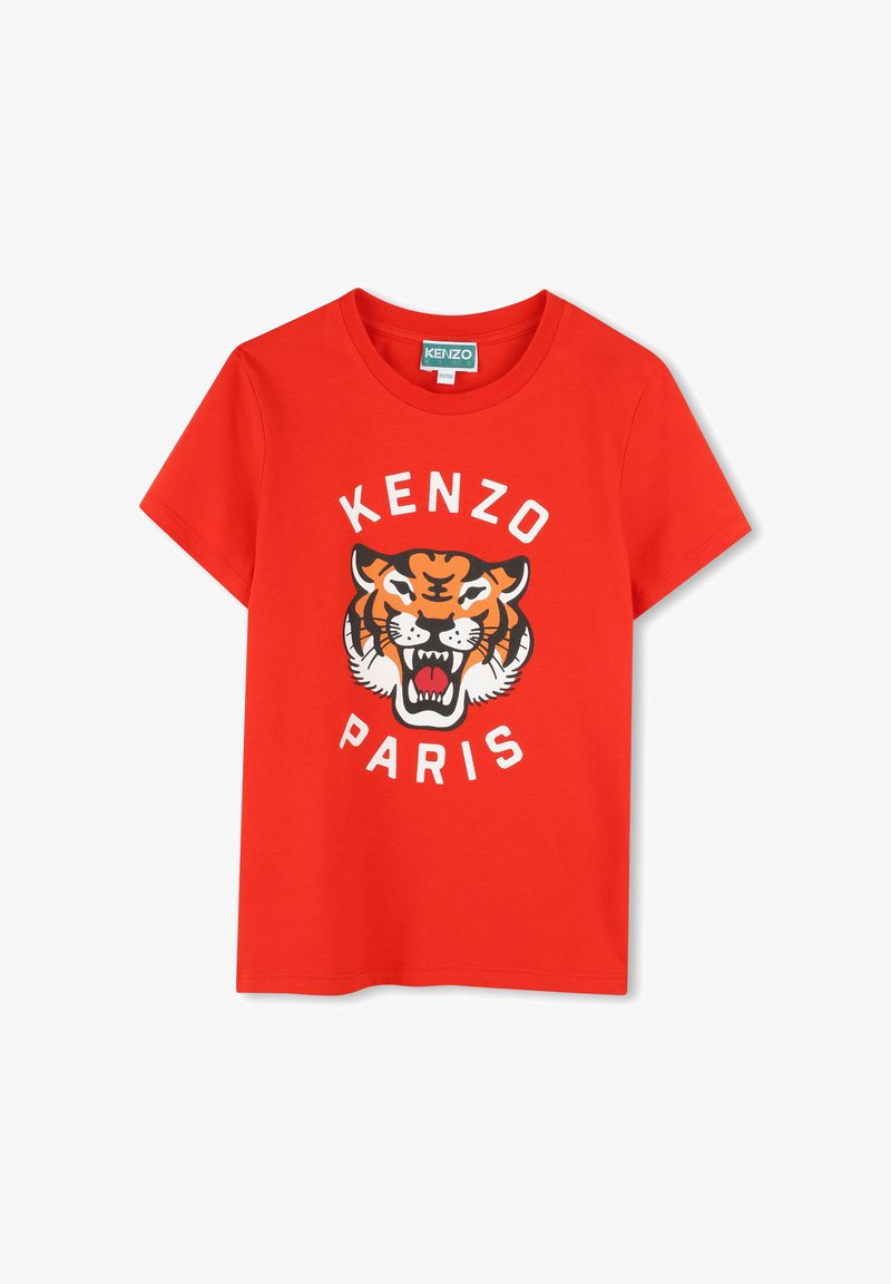 T-shirt en coton rouge avec un graphique de tigre et le texte "KENZO PARIS" en blanc, col rond, manches courtes et coupe décontractée.