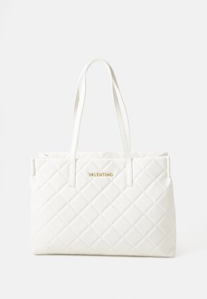 White quilted tote bag with dual handles. Features a gold logo on the front. Constructed from smooth, textured material. Rectangular shape.