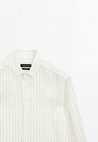 White long-sleeve button-up shirt with thin vertical black stripes and a pointed collar, laid flat on a white background.