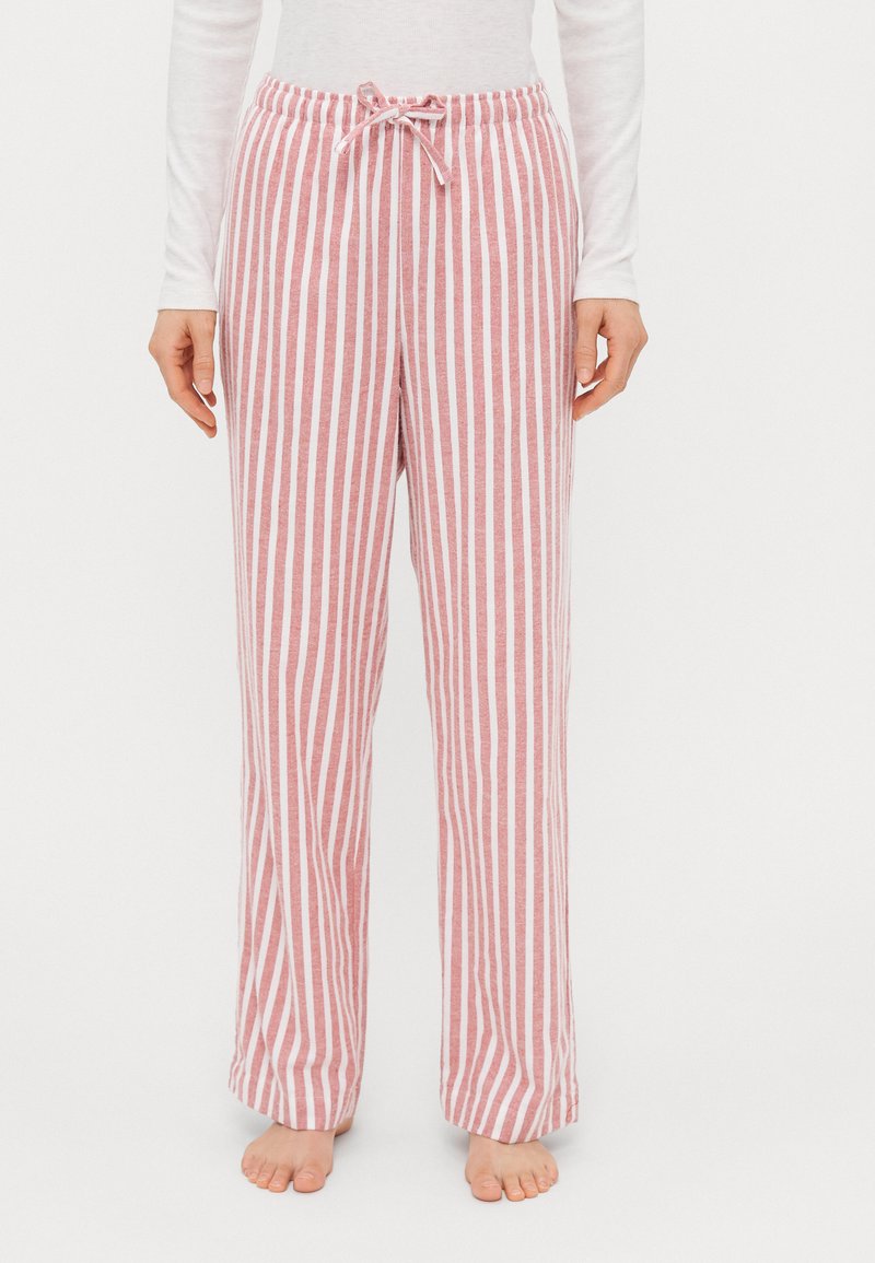 Red and white striped lounge pants with a drawstring waist and wide legs, made from soft fabric, with a casual and relaxed fit.