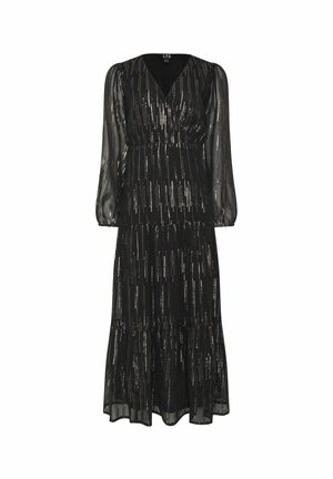 Pitkä musta mekko, jossa on läpinäkyvät pitkät hihat, V-mallinen kaula-aukko ja virtaava kerroksellinen hame, jossa on pystysuoria metallisia raitoja lisätekstuuria varten.