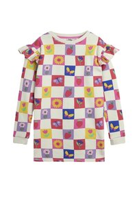 Camicia a maniche lunghe in crema con motivi colorati di fiori, farfalle e fragole. Presenta dettagli arricciati sulle spalle.