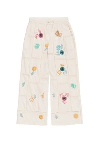 Helle, cremefarbene weite Hosen aus leichtem Stoff, mit buntem Blumenstickerei und Spitzenakzenten entlang der Nähte.