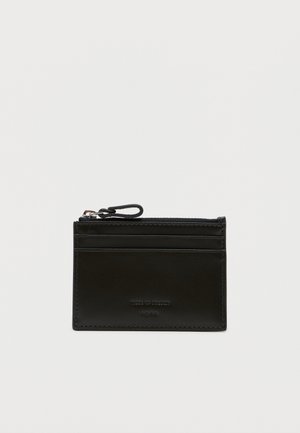 Black leather cardholder with a smooth texture, featuring multiple card slots and a zippered compartment at the top. Minimal branding visible.
