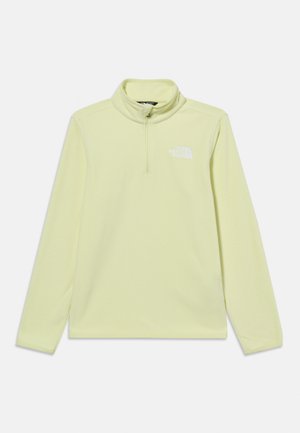 Pulover fleece galben deschis cu mâneci lungi, fermoar scurt și logo alb The North Face pe pieptul stâng.