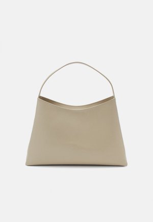 Beige handbag with a minimalist design, smooth texture, curved top, and a single, thin handle. No visible hardware or accents.