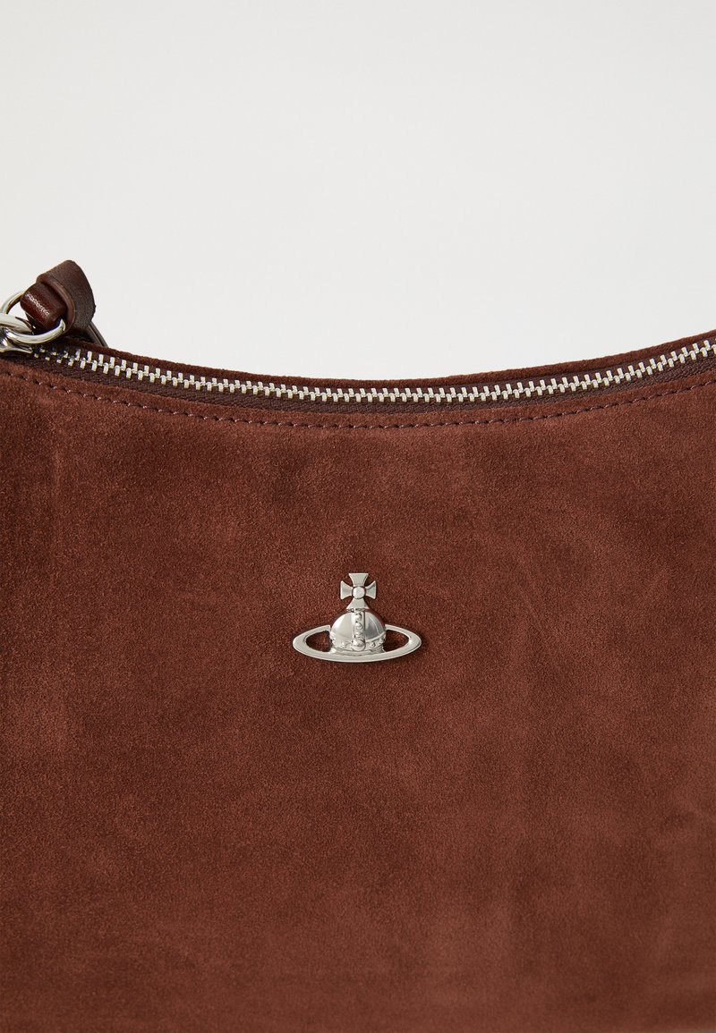 Brown suede handbag with a silver zip closure, featuring a distinctive silver hardware detail resembling a crown and orb design.