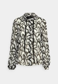Blusa a fantasia bianca e nera in tessuto leggero e trasparente. Presenta un colletto, bottoni frontali e maniche lunghe con polsini arricciati.