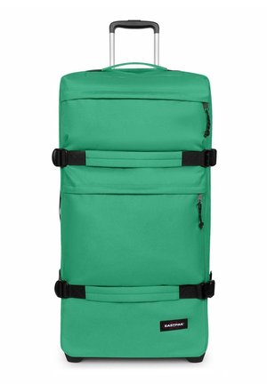 Valise souple rectangulaire verte avec des sangles noires, deux poches zippées, une poignée extensible et le logo Eastpak en bas à droite.