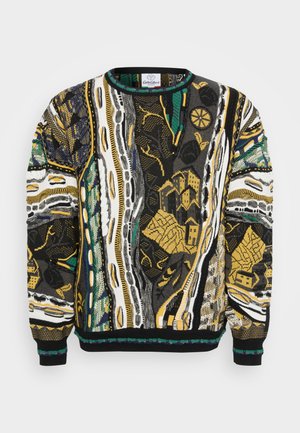 Knit sweater featuring vibrant abstract patterns in black, white, yellow, and green. Round neckline and ribbed cuffs complete the design.