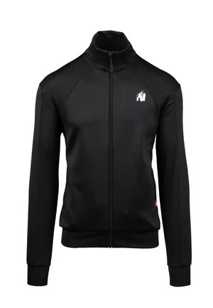 Zwarte ritsjack met hoge kraag, textuurpanelen op de mouwen en een wit logo op de borst. Heeft aansluitende manchetten en zoom.