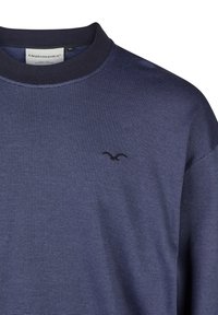 Navy blue, textured sweater with a mock neck and subtle horizontal stripes. Features a small, black logo on the left side of the chest.