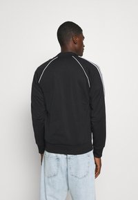 adidas Originals Cipzáras pulóver - black/white