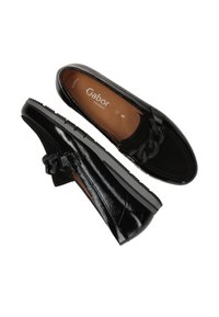 Black loafers made of patent leather with a textured finish, featuring a chain accent and a rubber sole. Gabor brand logo visible inside.