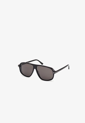 Gafas de sol negras con montura rectangular, lentes grises y patillas elegantes con un sutil logotipo. Textura suave, diseño moderno.