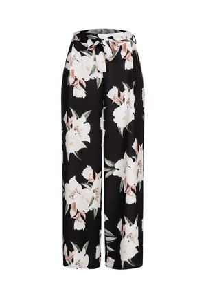 Fekete anyagból készült, bőszárú virágos nadrág, nagy fehér és rózsaszín virágmintákkal, megkötős derékrésszel a szabás állíthatóságáért.