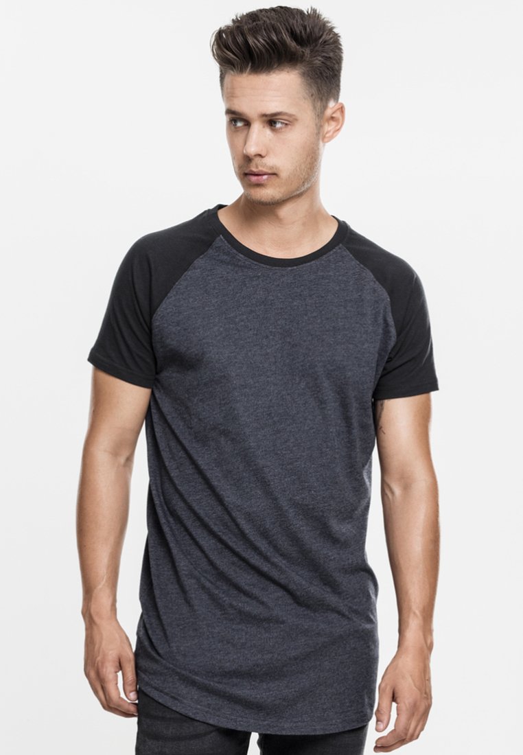 Dark gray raglan t-shirt featuring black short sleeves, a crew neckline, and a relaxed fit. Lightweight fabric with a smooth texture.