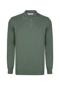 Groene langslavige polo met een kraag, drie-knopen pat en geribbelde manchetten en onderrand. Gemaakt van een zachte brei-stof.