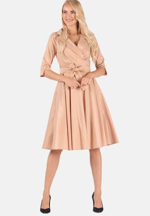 Rose-colored wrap dress with three-quarter sleeves, a tied belt at the waist, and a flared skirt. Smooth fabric and clean lines.