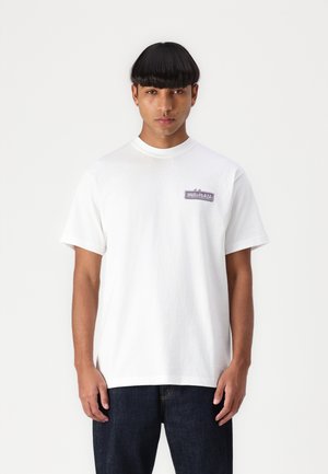 White cotton t-shirt with short sleeves, featuring a small purple logo "HUF-PLAZA" on the left chest area. Standard crew neck design.