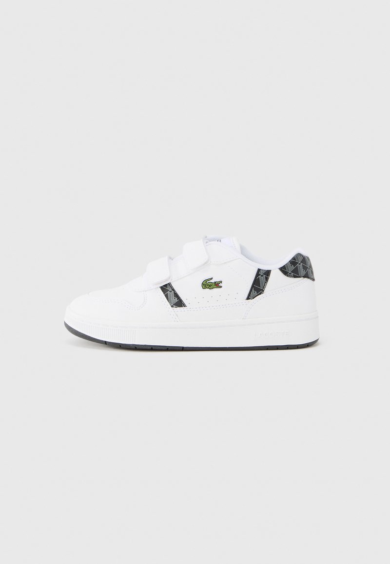 Άσπρα αθλητικά παπούτσια με λουράκια βέλκρο, μαύρο γεωμετρικό σχέδιο και πράσινο κεντημένο λογότυπο. Λαστιχένια σόλα με ελαφριά επιφ άνεια πρόσκρουσης.