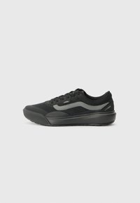Black athletic shoes with a mesh design, cushioned sole, and a grey side stripe. Features a rounded toe and a padded ankle collar.