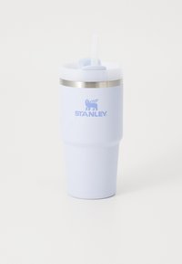 Light blue insulated tumbler with a smooth finish, silver metal band, and a white lid featuring a straw opening, branded with "STANLEY."