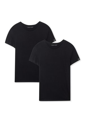 T-shirt in cotone nero con scollatura a girocollo e maniche corte. Design semplice, texture liscia, con un piccolo logo sulla manica.