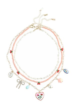 Three layered necklaces with gold chains, pink and white beads, small red and green floral accents, and various charms including a heart and a bow.