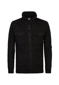 Zwarte ritstruij met hoge kraag, gemaakt van gestructureerde stof. Heeft twee vo vakken met knoopsluitingen en ribgebreide manchetten.