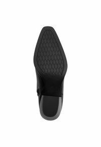 Semelle en cuir noir avec une surface en caoutchouc texturé présentant un motif en losange. Forme moulée avec une finition lisse à l'avant et au talon.
