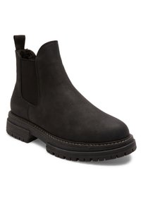 Botte Chelsea en cuir synthétique noir avec panneaux latéraux élastiques, surface texturée, bout rond et semelle en caoutchouc épaisse avec des lignes horizontales.