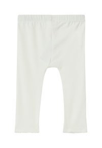 Weiße Baumwollleggings mit einem elastischen Bund, gerade geschnitten und mit einem gewellten Saum am Knöchel. Weiche Textur, knielange Längen.