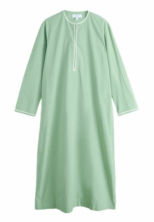 Vaaleanvihreä puuvillainen tunikamekko, jossa on pitkät hihat, pyöreä pääntie ja kontrastiväriset valkoiset reunukset pääntiellä ja hihojen reunoissa.