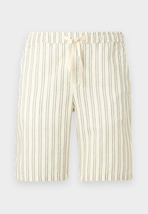 Svjetlo bež kratke hlače s uskim vertikalnim crnim prugama i elastičnim pojasom vezanim bež vezicom.