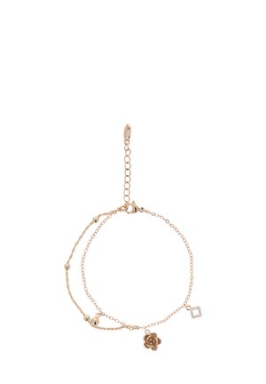 Doppelter Armband in goldfarben mit einem blumigen Charme, einem geometrischen Charme und kleinen sphärischen Akzenten. Die Kettenglieder variieren in der Größe.