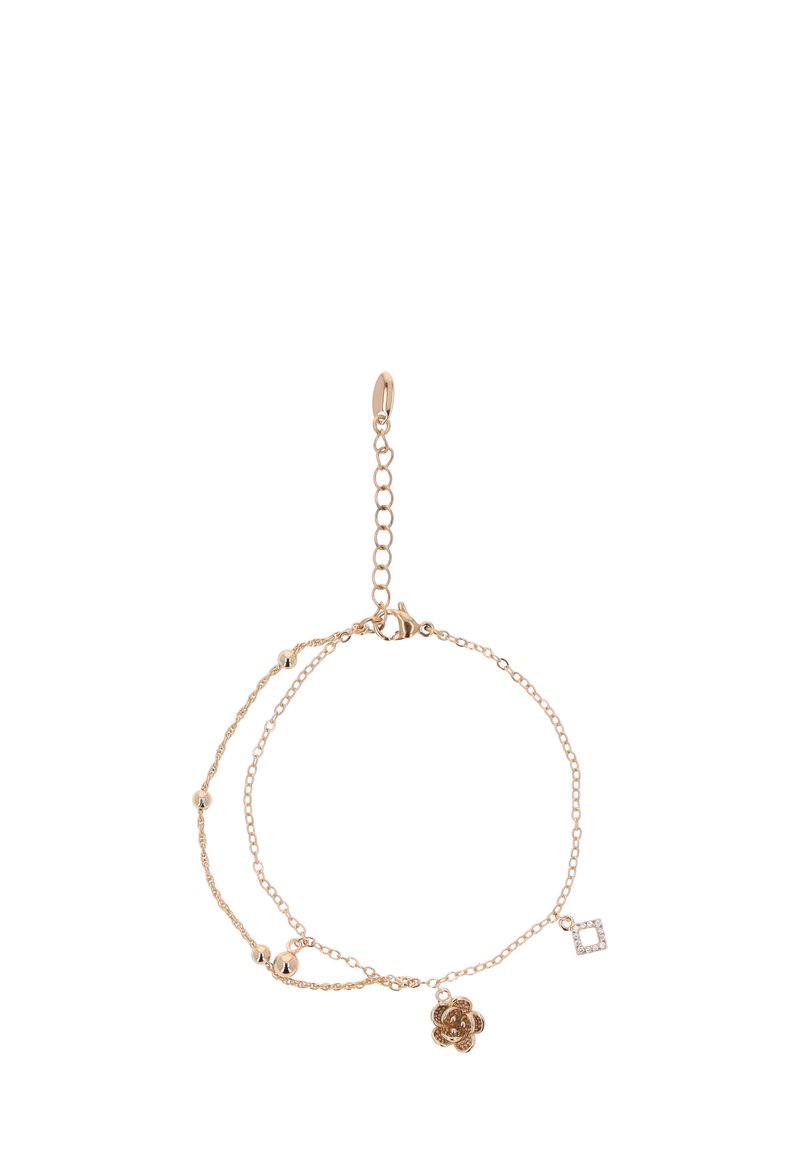 Arany színű, dupla rétegű karkötő virágos és geometrikus charmokkal, valamint apró gömb alakú díszekkel. A láncszemek mérete változó.