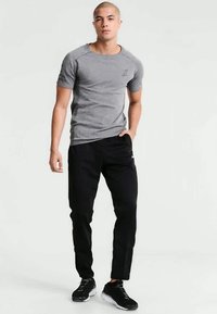 Joma ELBA - Παντελόνι φόρμας - black