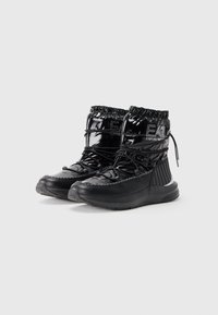 Black patent ankle boots with a padded shaft, elastic top, and textured accents. Featuring lace-up design and rubber sole for support.
